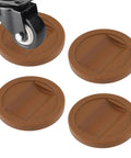 Brown Couch Stoppers Four Pack Stop Slipping For Sofas Beds Chairs And More Durable Plastic Caster Cups Fit Most Furniture Wheels Under One And A Half Inches With Deep U Shape To Keep Your Furniture In Place, shown with a furniture wheel.