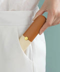 Person pocketing Stainless Steel Fruit Peeler Knife For Kitchen And Camping Use, Portable Double Head With Orange Handle, in pocket