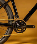 Close-up of bike chain and gears featured in the All-In-One Bike Chain Repair Kit For 6/7/8 Speed E-Bikes And MTB Road Rigs