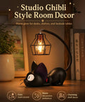 Jiji Black Cat Night Light Inspired by Kiki's Delivery Service on desk with books and plant, cozy resin lamp for bedroom dorm decor.
