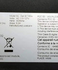 Label on Dell B1160w wireless monochrome printer showing model, safety information, and specifications.