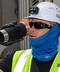 Worker in hard hat using Stainless Steel Tumbler With Flip Top Lid 20 Oz Insulated Double Wall Vacuum Mug With Slip Resistant Sleeve