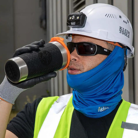 Worker in hard hat using Stainless Steel Tumbler With Flip Top Lid 20 Oz Insulated Double Wall Vacuum Mug With Slip Resistant Sleeve