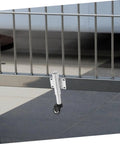 Heavy Duty Sliding Gate Rollers Loaded With Spring Shock Absorption And Height Adjustments For Iron And Retractable Gates Built Tough. Close-up of metal roller mounted on gate track.