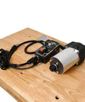 Badass 3 1/4 Horsepower Router Motor With External Variable Speed Control on a wooden table, featuring variable speed dial and wiring.
