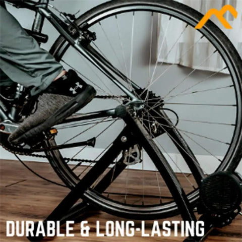 Replacement Quick Release Rear Skewer For Road And Mountain Bike Trainers in a home gym setup with bike on trainer.