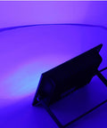 Onythral LED Flood Light in back view, showcasing sleek design and purple illumination, ideal for outdoor use.