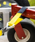 2 Inch By 24 Inch Premium Axle Tie Down Strap With D Rings securing cargo on flatbed trailer
