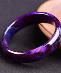 Raw Mineral Emperor Purple Perilla Stone Bracelet With Shudulai Old Material on textured surface