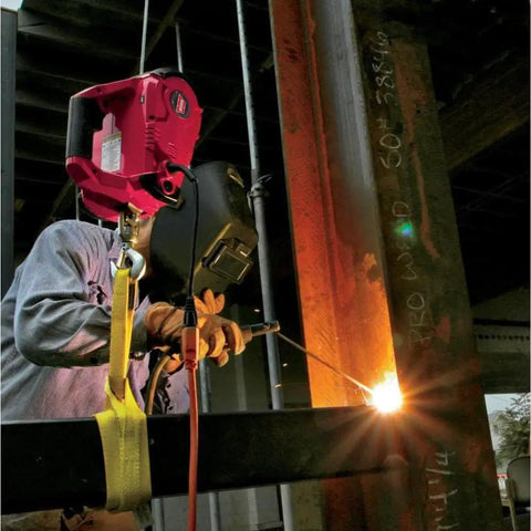Heavy-Duty 120V AC Electric Winch With 1000 Lb Capacity For Vehicle Recovery, No-Load Line Speed Of 13.8 Fpm, Built Tough For Real-World Rugged Jobs, Easy To Use And Durable Winch That Replaces Outdated Come-Alongs. worker using heavy-duty electric winch during steel beam welding