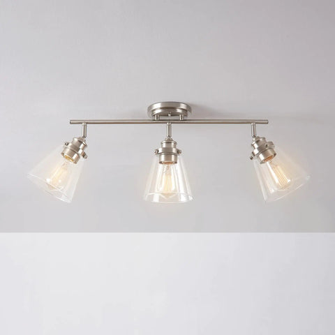 Vintage Inspired Dope Brushed Nickel Three Light Track Lighting With Pivoting Heads And Clear Glass Shades For Industrial Farmhouse Coastal Spaces Bulb Not Included, mounted on ceiling, showcasing clear glass shades.