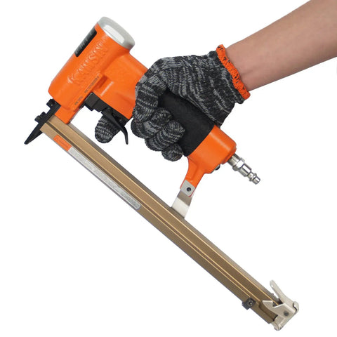 Person holding Pro Grade Heavy Duty Upholstery Stapler For Furniture Making With Extended Magazine That Holds 200 Staples