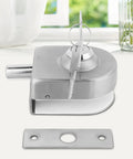 Rock Solid Glass Door Lock Featuring Corrosion Resistant Satin Nickel Twist Handle Heavy Duty Floor Latch For Sliding Panels 10 To 12 Mm Thick close-up of twist handle lock with key.