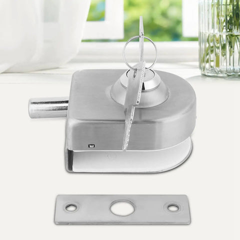 Rock Solid Glass Door Lock Featuring Corrosion Resistant Satin Nickel Twist Handle Heavy Duty Floor Latch For Sliding Panels 10 To 12 Mm Thick close-up of twist handle lock with key.