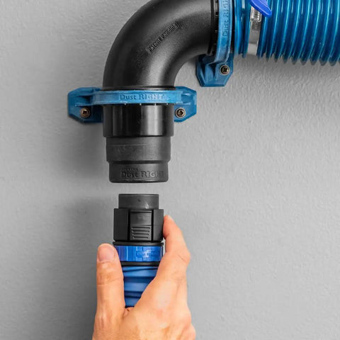 Click Connect Flexi Port Two And A Half Inch Fitting Adapter for dust collection installed on wall with blue and black connectors