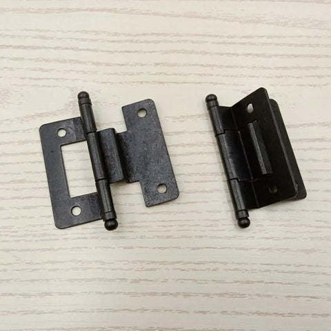 Pair of black metal cabinet hinges with mounting plates, top-down view for residential cupboards