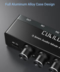 Close-up of a black 4 Channel Ultra Low Noise Mini Audio Mixer with 3.5mm input, featuring aluminum alloy case and USB input for compact setups.