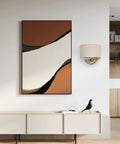 Stylish Industrial 2 Light Wall Sconce With Linen Fabric Shade above modern sideboard with abstract art in warm tones.