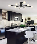 Eight Light Black Sputnik Ceiling Fixture in modern kitchen with black cabinets and white island, semi flush mount design