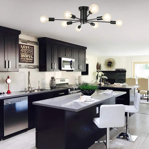 Eight Light Black Sputnik Ceiling Fixture in modern kitchen with black cabinets and white island, semi flush mount design