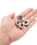 12Pc Tough As Nails Stainless Steel Spacers 12Mm Bore 20Mm OD 10Mm Long in hand showing their durable design.