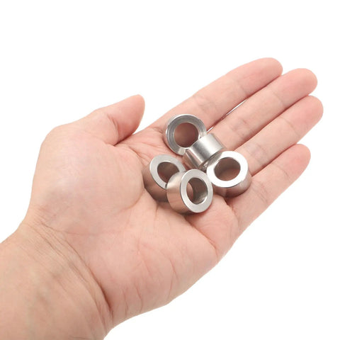 12Pc Tough As Nails Stainless Steel Spacers 12Mm Bore 20Mm OD 10Mm Long in hand showing their durable design.