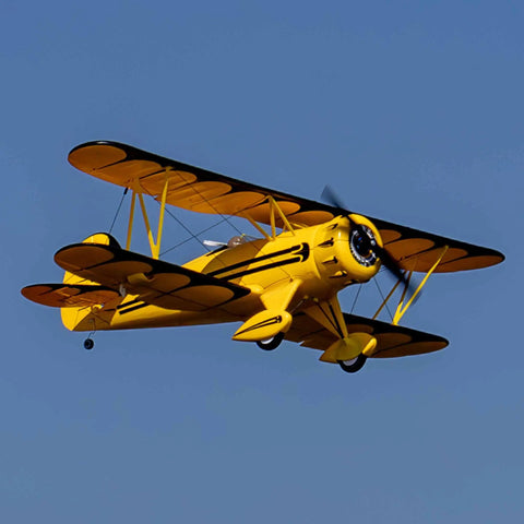 UMX Waco Yellow RC Airplane Bind-N-Fly BNF with AS3X and Safe Technology in flight against blue sky