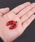 Helicopter Swashplate Leveler Pro Grade Tool for Flight Training and Maintenance, red metal tool in hand, compatible with 380 470 600 and 700 RC Helis built for precise calibration quick adjustments and durable field use