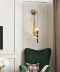 Gold Vintage Wall Sconce with Prismatic Clear Glass Tube (Metal Lamp Body) illuminating a stylish living room.