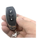 Hand holding remote of Dope Remote Control Switch Module For DC 3V To 12V Motors With Forward And Reverse Stop Mini RF Wireless Controller.
