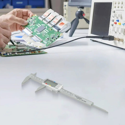 Micpointik Digital Caliper 6 Inch, 4-Way Measurement Tool on a workbench with a person analyzing a circuit board.