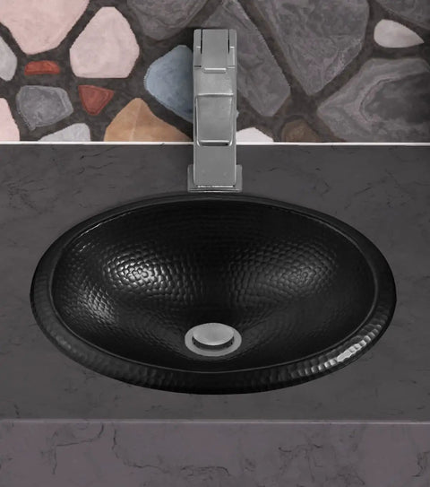 17 Inch Oval Drop In Matte Black Bathroom Sink With Hand Hammered Finish, top view in a modern rustic bathroom setting