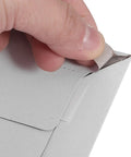 A hand peeling the seal of an A4 Gray White Self Sealing Paper Mailing Envelopes Thickened For Documents And Photos 30 Pack Great For Small Biz Shipping Easy Seal Mailers For Cards Invitations Postcards And Packages