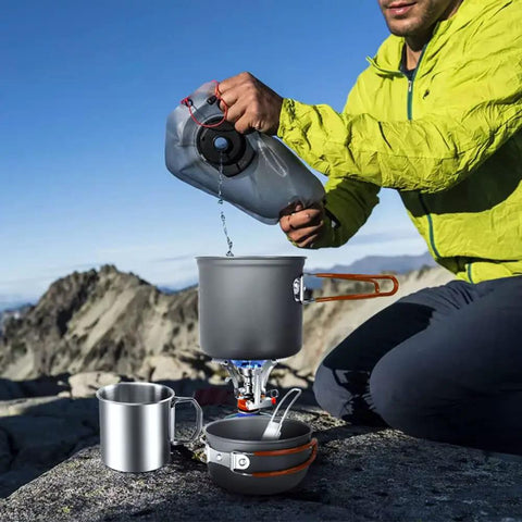 8 Piece Camping Cookware Mess Kit With Mini Backpack Stove All In One Nonstick Pots Stainless Spork Foldable 14 Oz Mug in use