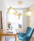 Slick Modern Metal 5 Light Pendant Chandelier Ceiling Lamp above a desk, featuring natural wood shades and bright lights.