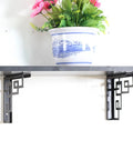 Rock Solid Heavy Duty Iron Corner Shelf Brackets Two Pack supporting shelf with decorative plant for kitchen and living room.
