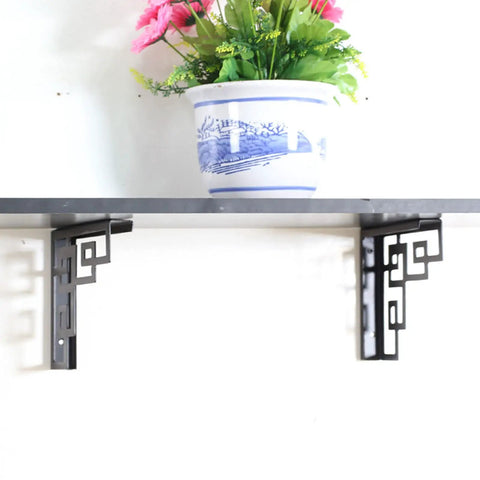 Rock Solid Heavy Duty Iron Corner Shelf Brackets Two Pack supporting shelf with decorative plant for kitchen and living room.