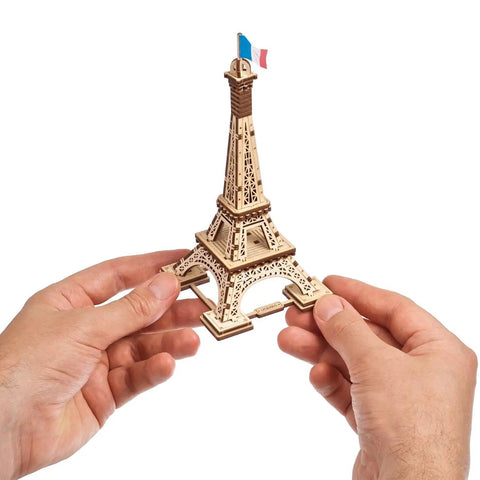 Paris Tower 3D Puzzle Kit No Glue Needed, 50 Wooden Pieces, 7.08 Inch Tall, Brown Finish, Easy Build For DIY Enthusiasts And Collectors, World Cities Collection, Fun Desk Model For Kids And Adults. Wooden Eiffel Tower model in hands
