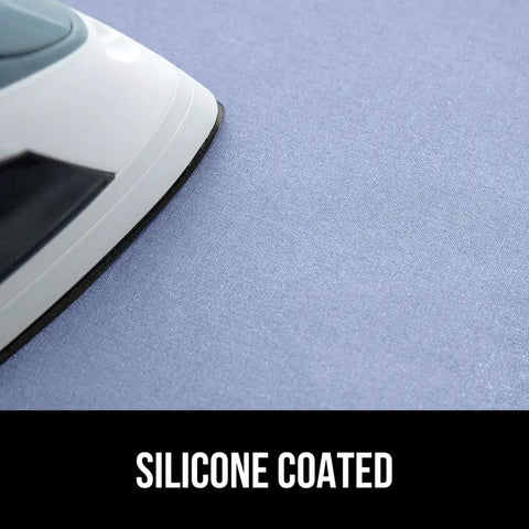 Close-up of iron on Magnetic Ironing Blanket Travel Size 28x24 With Silicone Coating Scorch Resistant Up To 400 Degrees, blue surface