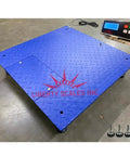 Heavy Duty Commercial Floor Scale Built Tough As Nails For Warehouse Shipping Pallet Weighing 24 X 24 Inch Platform in blue with a digital display.