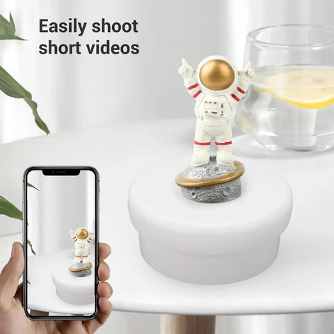 Stunning Electric Rotary Display Stand With 360 Degree Rotation For Jewelry Photography showcasing an astronaut figurine on a turntable.
