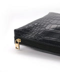 Side view of a suitcase with a golden zipper pull from the 4 Pack Zipper Pull Tabs Replacement Metal Zipper Handles For Luggage Suitcases Jackets Boots.