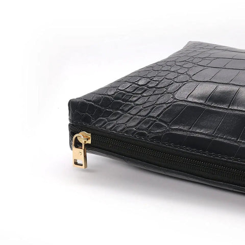Side view of a suitcase with a golden zipper pull from the 4 Pack Zipper Pull Tabs Replacement Metal Zipper Handles For Luggage Suitcases Jackets Boots.