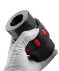 Gloved hand holding Heavy Duty 45 Steel Flexible Shaft Coupling With Jaw Type And Elastomeric Spider D40 L66 Bore 12-19mm