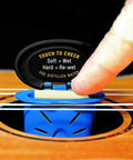 Humilele Ukulele Humidifier With Anti Drip Sponge Secures Between Strings And Fits All Sound Holes Keeps Your Ukulele Humidity Between Forty And Fifty Five Percent No Mess Water Reservoir That Holds Ten Times Its Weight. blue ukulele humidifier in sound hole being checked by finger
