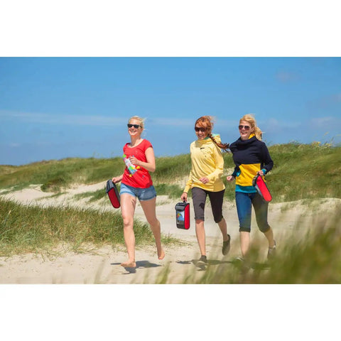 Three people carrying Rainbow 1.8 Stunt Kite for Beginners and Pros with Dual Line Foil Sport Kite, walking on a sandy beach.