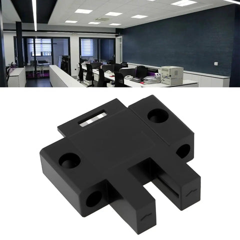 SX670P Slot Type Photoelectric Sensor 25.5 by 28.5 mm, 5mm U-shaped slot, black plastic in an office setting