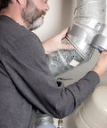 Man applying Beefy Heavy Duty Waterproof Duct Tape 1.88 Inch Wide By 35 Yards Strong Adhesive for sealing metal ductwork
