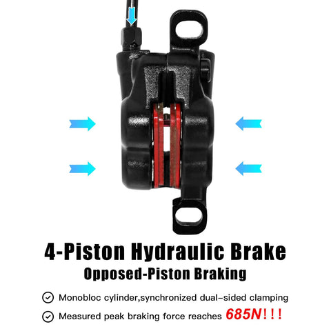 Front view of black 4-piston hydraulic MTB disc brake caliper with red pistons.
