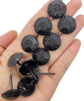 Straight Up Premium Black Metal Upholstery Tacks 100 Count With Sleek 19Mm Rounded Heads and Tough 23Mm Shafts shown in hand.
